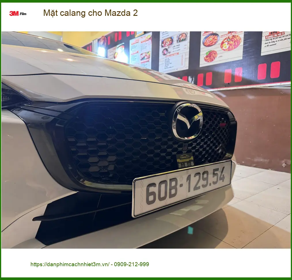 Chị Thảo độ Mặt calang cho Mazda 2 tại Quận 5 để xe thêm phần cá tính và sang trọng