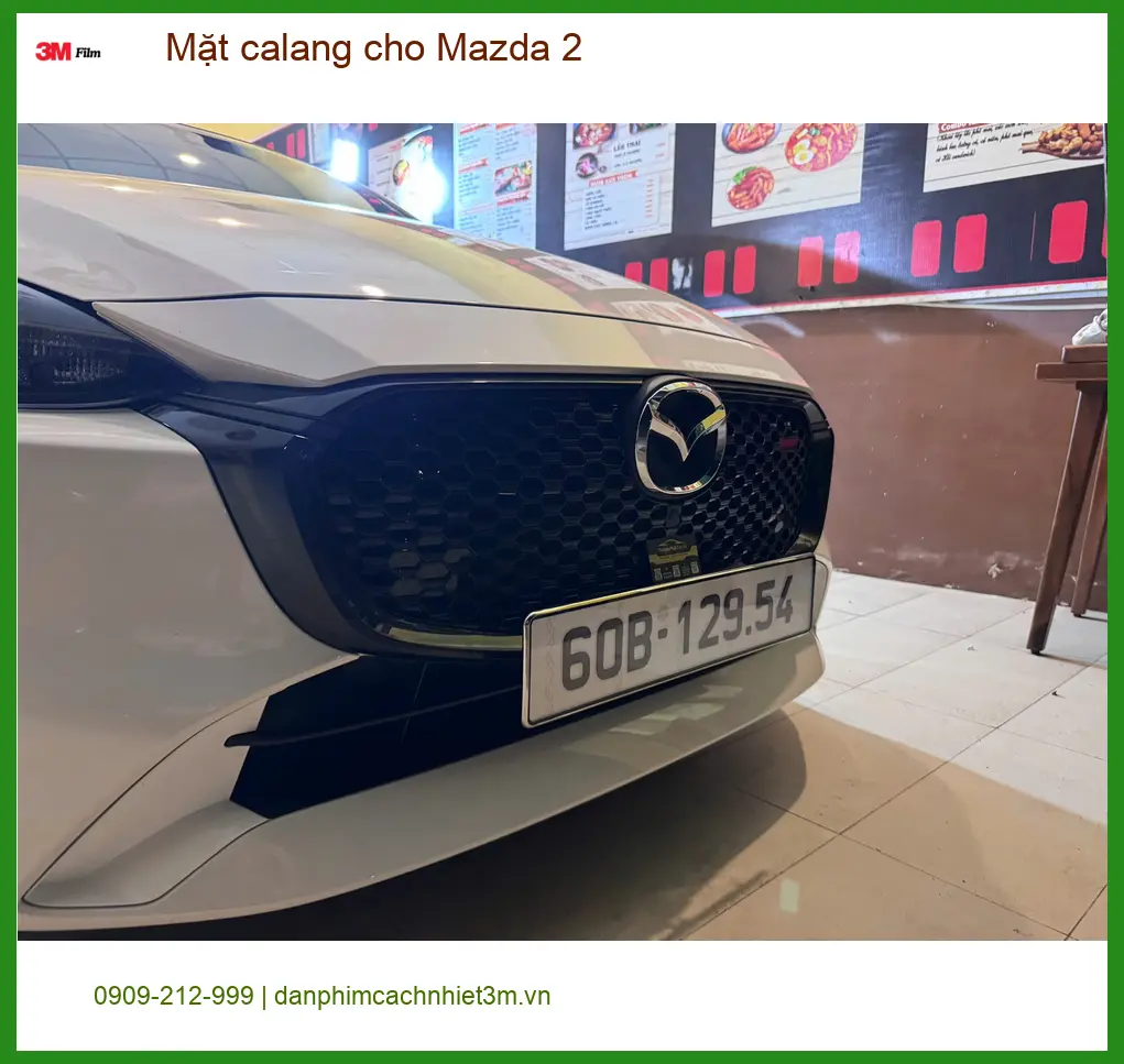 Chị Thảo độ Mặt calang cho Mazda 2 tại Quận 5 để xe thêm phần cá tính và sang trọng ảnh thực tế 2