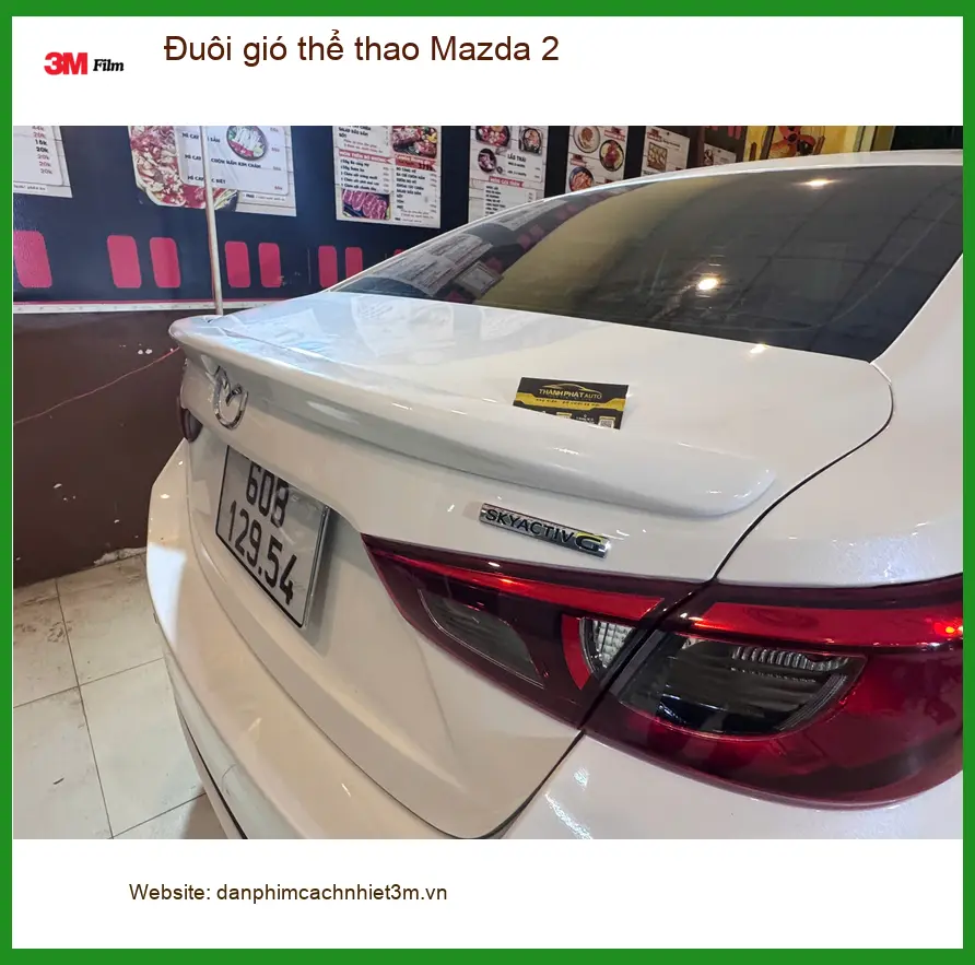 Anh Vĩnh lắp đuôi gió thể thao Mazda 2 tại Quận 3 để xe thêm phần cá tính ảnh thực tế 3
